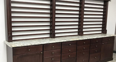 Custom commercial display painted dark espresso and used for displaying fingernail polish